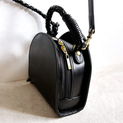 Leather bag with braided leather handles
