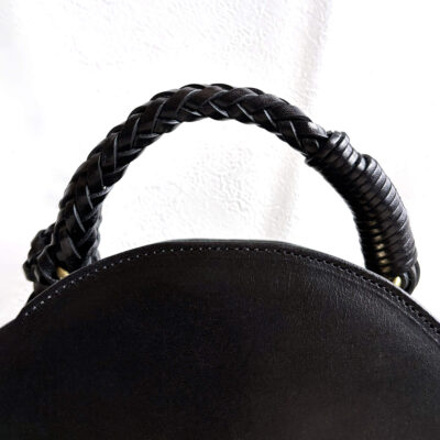 Leather bag with braided leather handles
