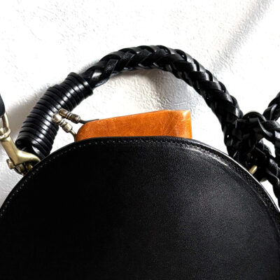 Leather bag with braided leather handles