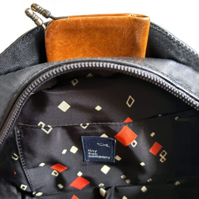 Leather bag with braided leather handles