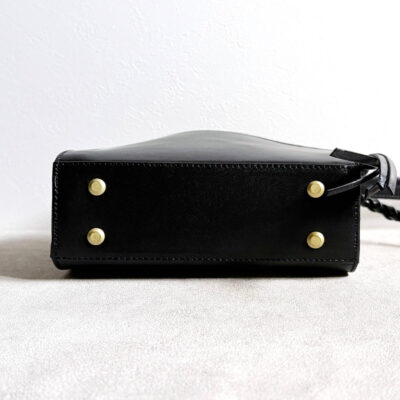 Leather bag with braided leather handles