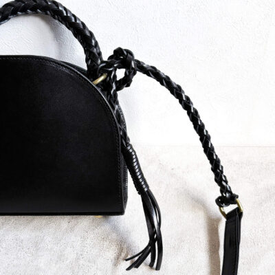 Leather bag with braided leather handles